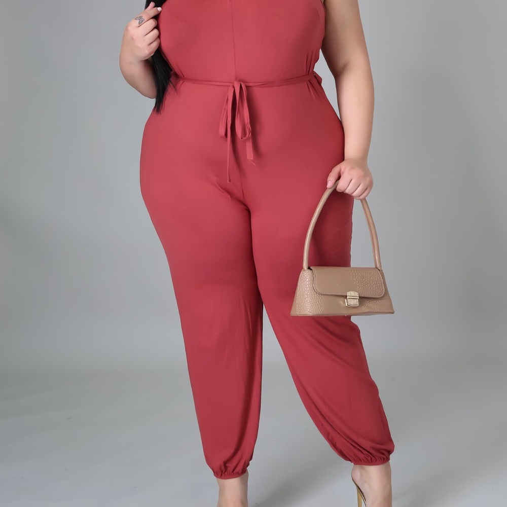 Great stretch 1 piece jumpsuit with tie belt.